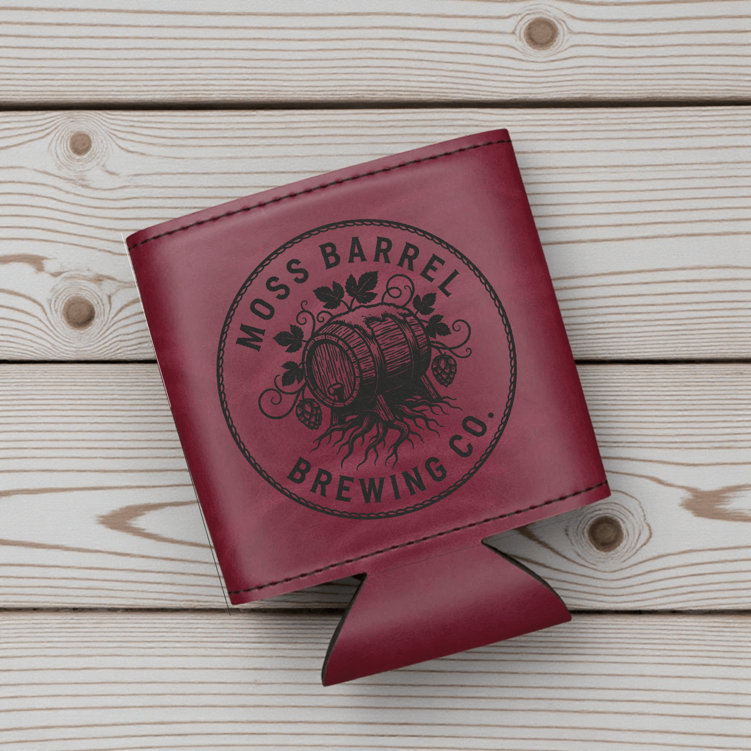 Personalized leatherette can coolers featuring Moss Barrel Brewing Co. logo on a stylish burgundy design.