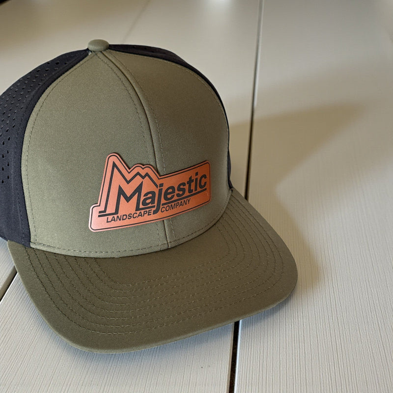 Custom branded hats and beanies featuring Majestic Landscape logo on olive green cap.