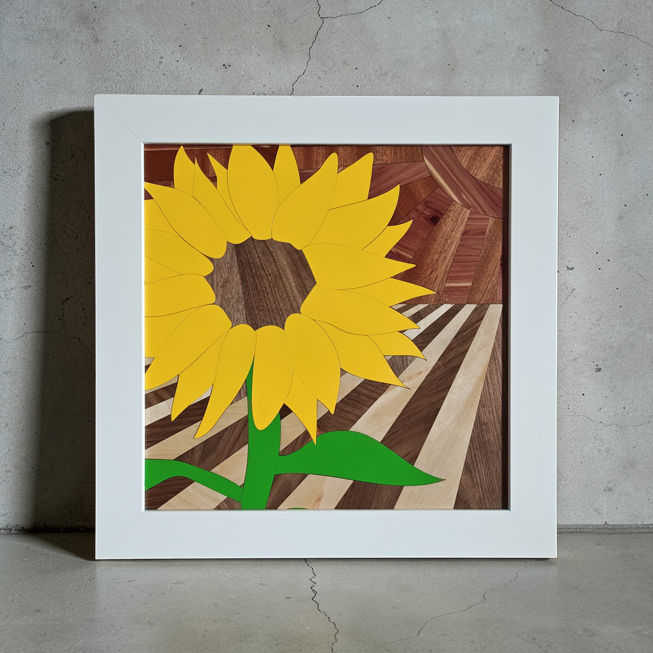 Custom wood wall art featuring a carved pumpkin and yellow flower in an elegant frame.