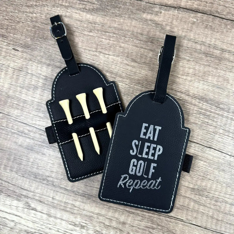 Engraved golf accessories featuring leather tag with golf tees and "Eat Sleep Golf Repeat" design.