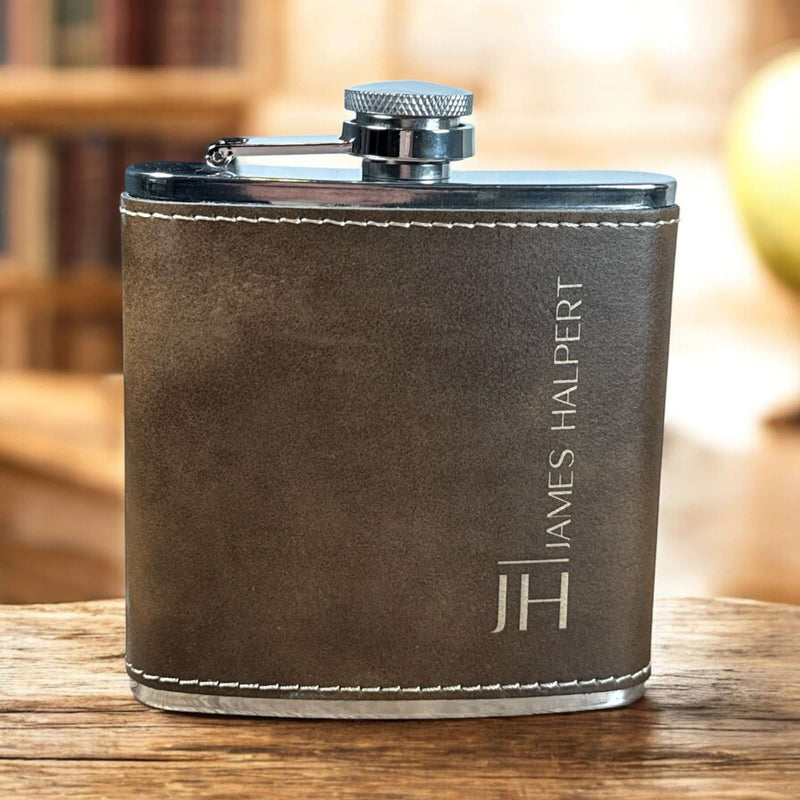 Custom Engraved Flasks | Personalized flask with a brown leather exterior and custom initials engraved, perfect for gifts.