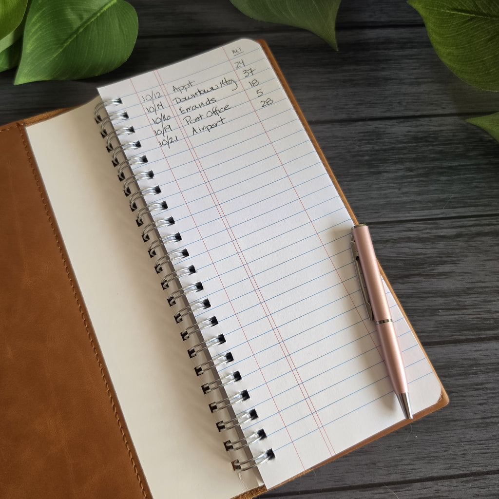 Open leatherette tally book cover showing interior notebook pocket