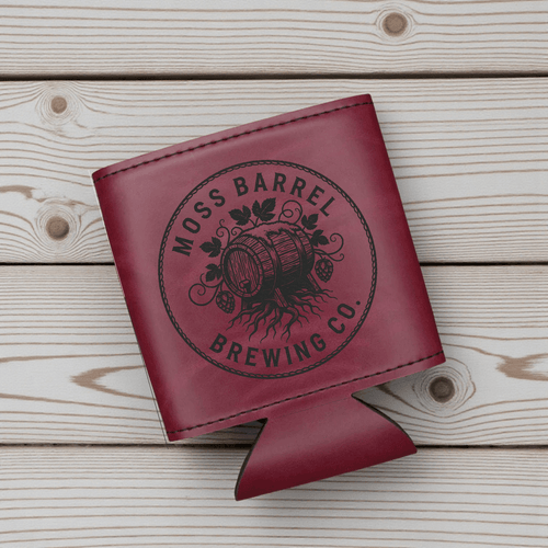 Custom Engraved Leatherette Can Duster with Moss Barrel Brewing Co logo on a wooden background.