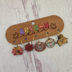 Hand-painted autumn wine charm attached to stemmed wine glass