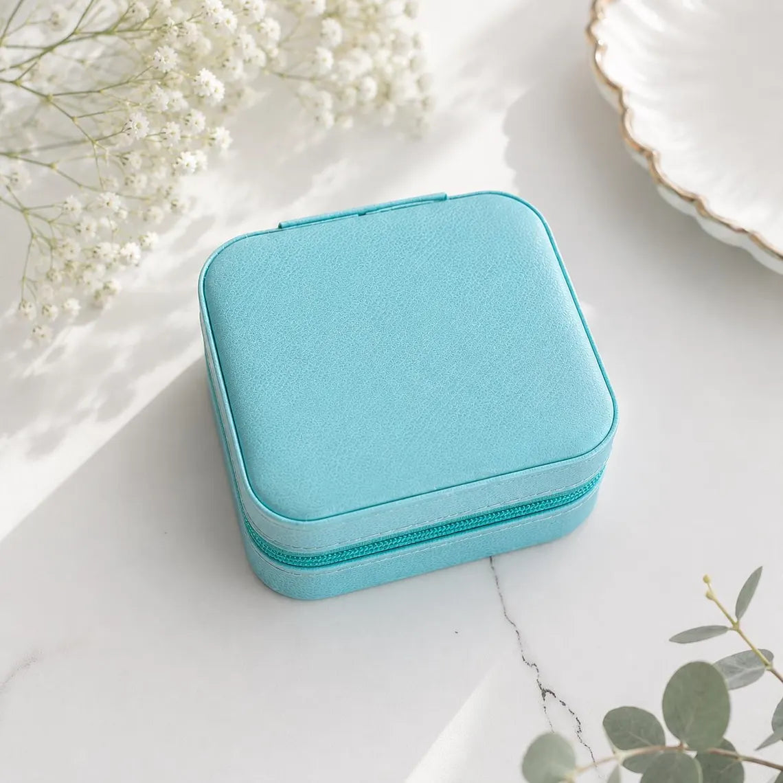 Compact personalized jewelry case with soft suede interior for travel in aqua