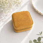 Compact personalized jewelry case with soft suede interior for travel in light brown